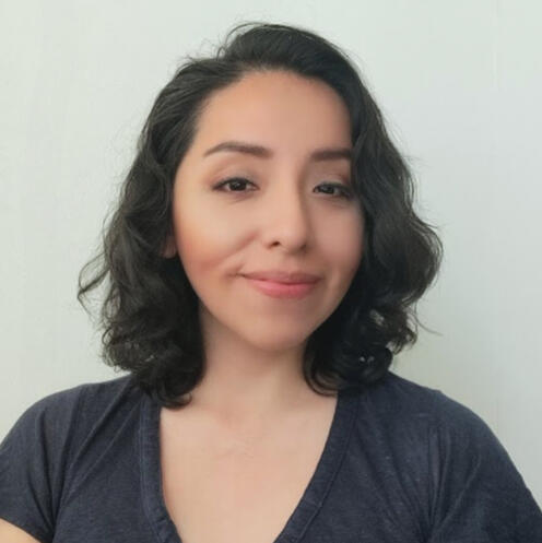 Aida headshot Aida, a latine woman with shoulder-length black hair, smiling on a white background